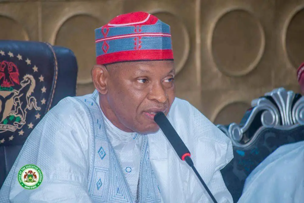 Governor Yusuf appears with red cap, NNPP flag at council meeting amid defection rumours